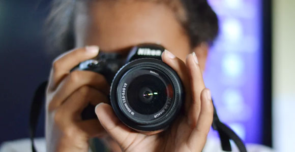 Student with a camera